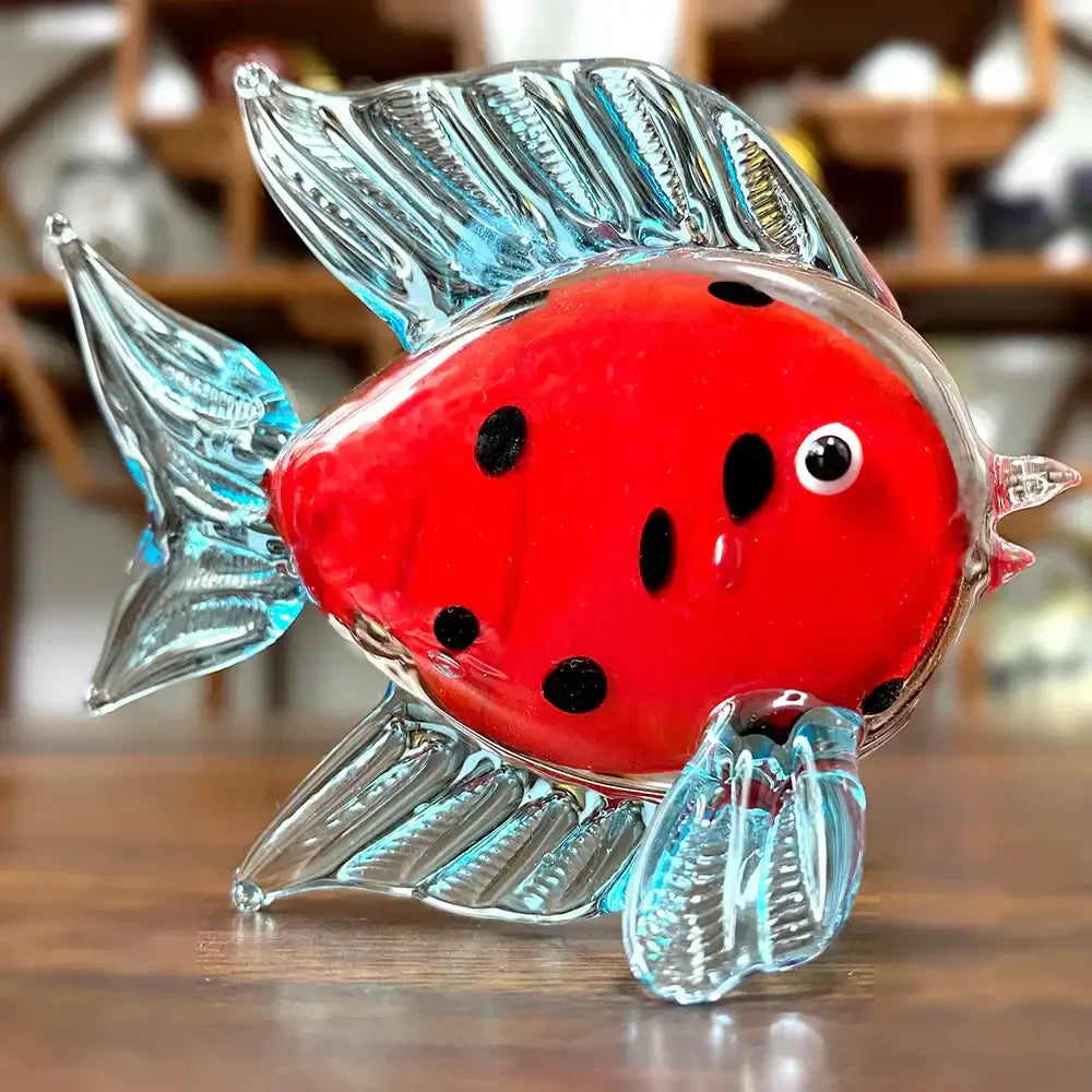 A vibrant red hand blown decorbites crystal glass tropical fish figurine with translucent blue fins for living room decor