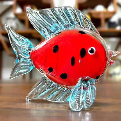 A vibrant red hand blown decorbites crystal glass tropical fish figurine with translucent blue fins for living room decor