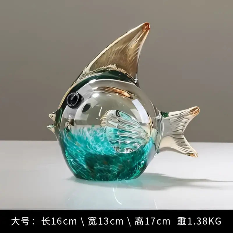 Hand blown glass fish figurine with translucent teal body gold fins and black bead eyes for living room decor