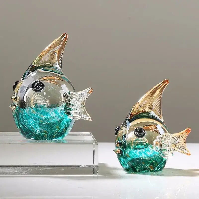 Two hand blown glass fish figurines in turquoise and clear with gold tipped fins for living room decor