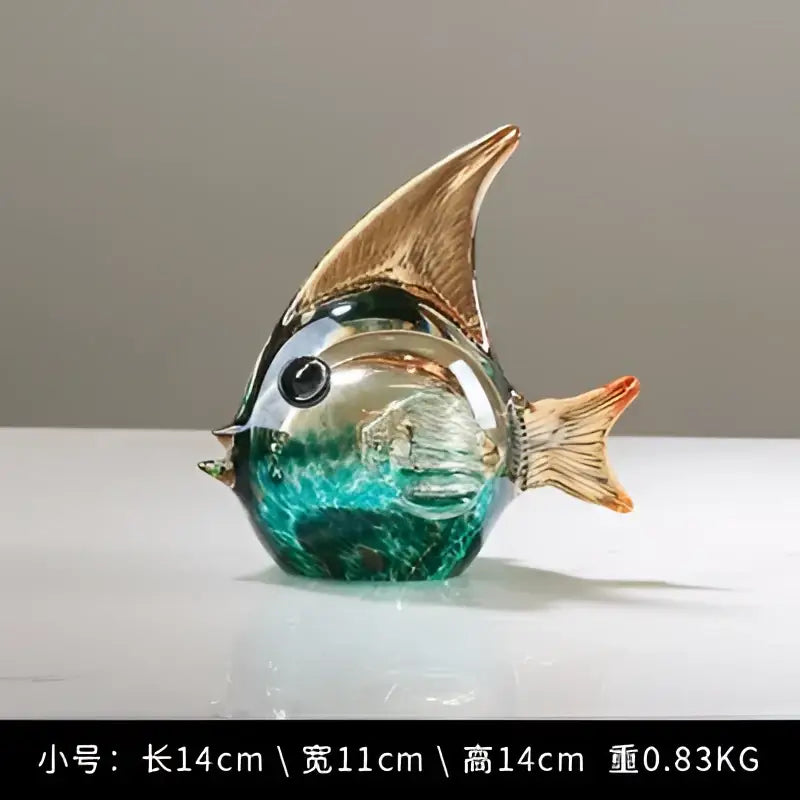 Hand blown glass fish figurine with teal and green swirls, gold-tinted fins, black bead eyes for living room decor