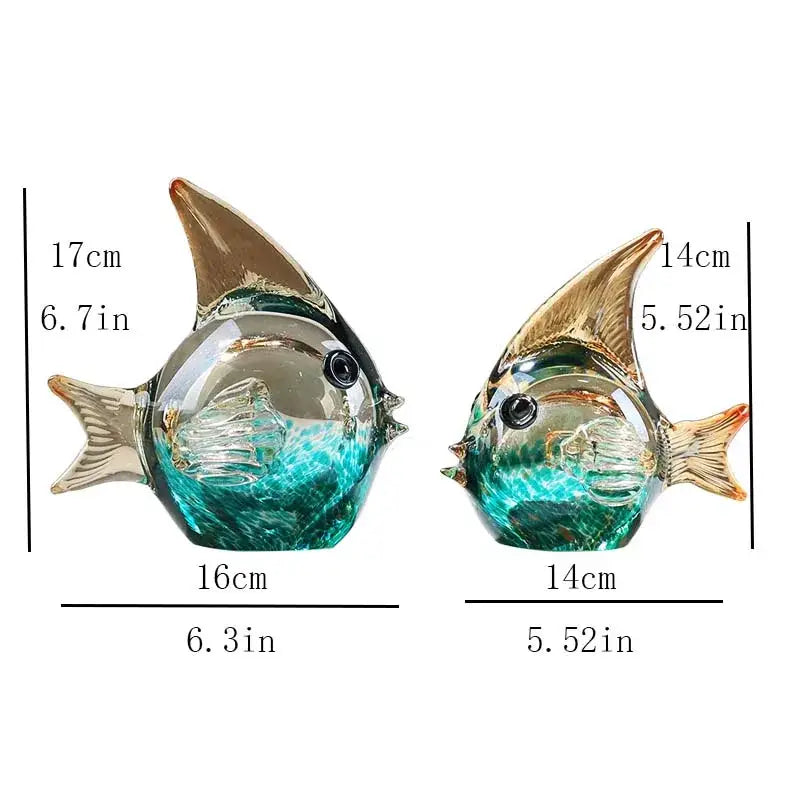 Two hand blown glass fish figurines with turquoise and green swirls and gold tinted fins for living room decor