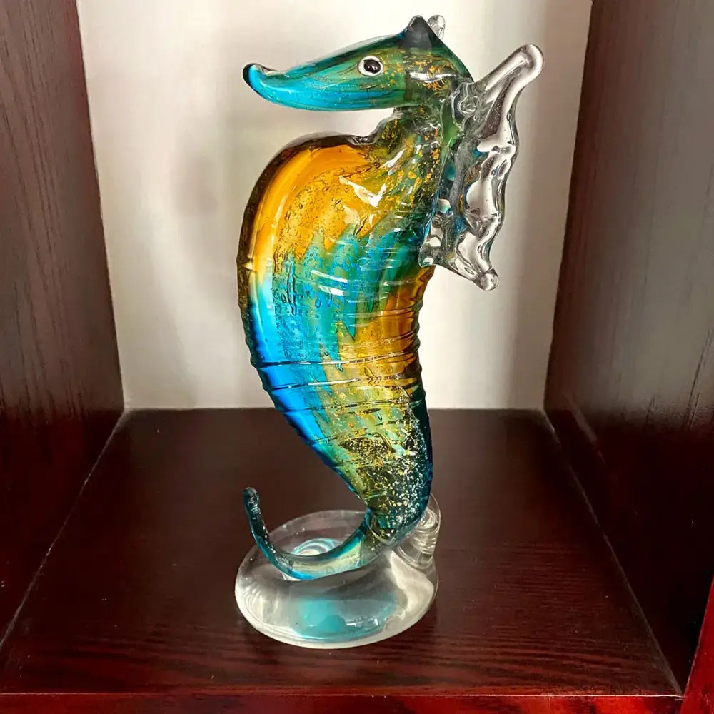 Vibrant hand blown glass seahorse figurine with turquoise amber and green hues for living room decor
