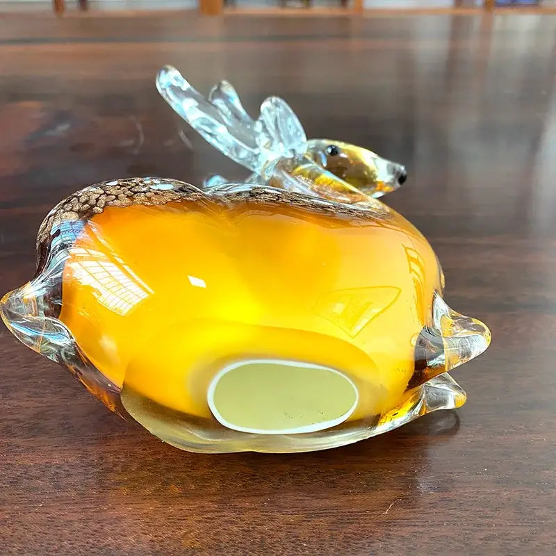 Hand blown glass sika deer figurine in translucent amber with clear antlers and speckled brown pattern for decor