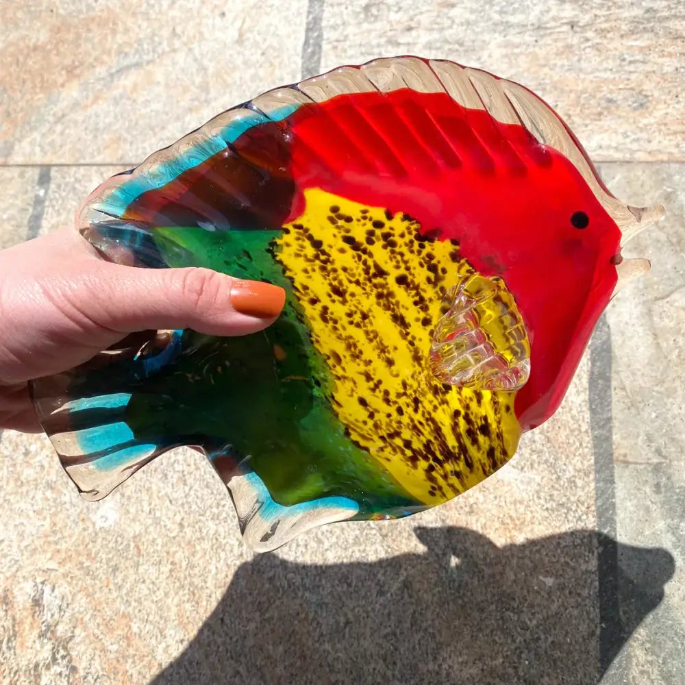 Vibrant multicolored hand blown tropical glass figurines featuring red yellow green and blue sections for living room decor
