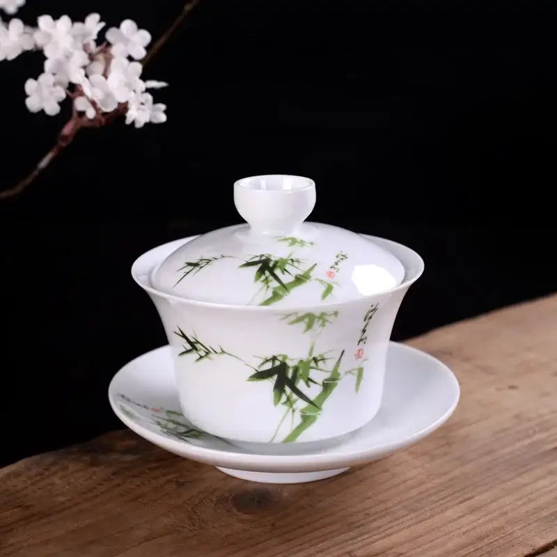 Hand painted bird and bamboo white porcelain gaiwan tea set with green bamboo and red calligraphy decorbites blue design
