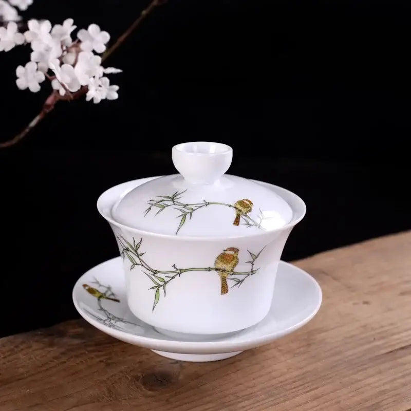 White porcelain gaiwan with hand painted bird and bamboo design for dining room tea set by decorbites blue