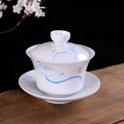 White porcelain gaiwan teacup with hand-painted blue lotus vines and red seals for decorbites blue tea set