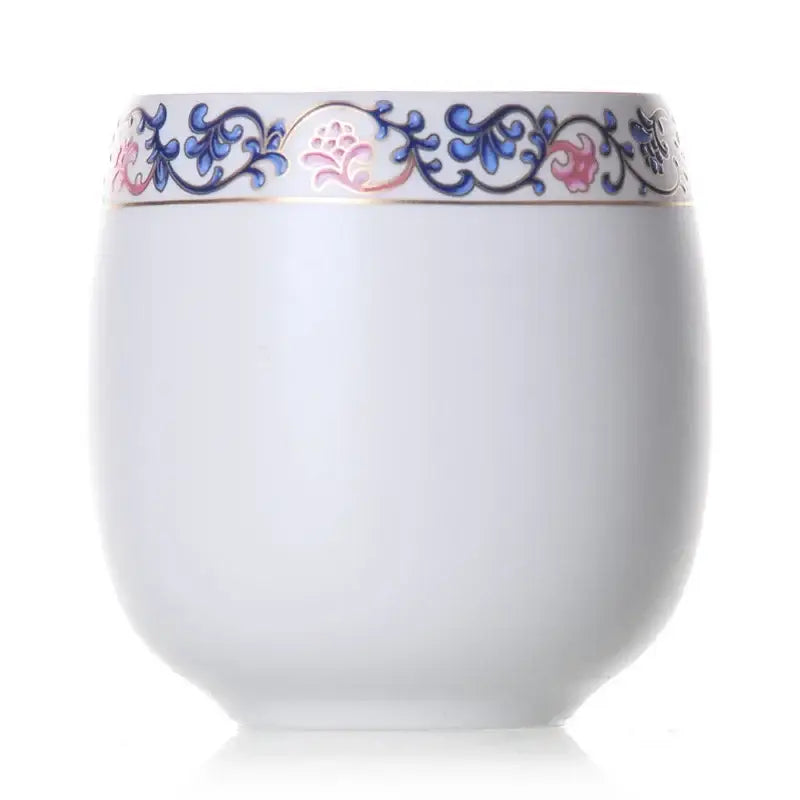 A white porcelain kung fu tea cup with hand-painted blue and pink floral border and gold trim from decorbites ceramic kung