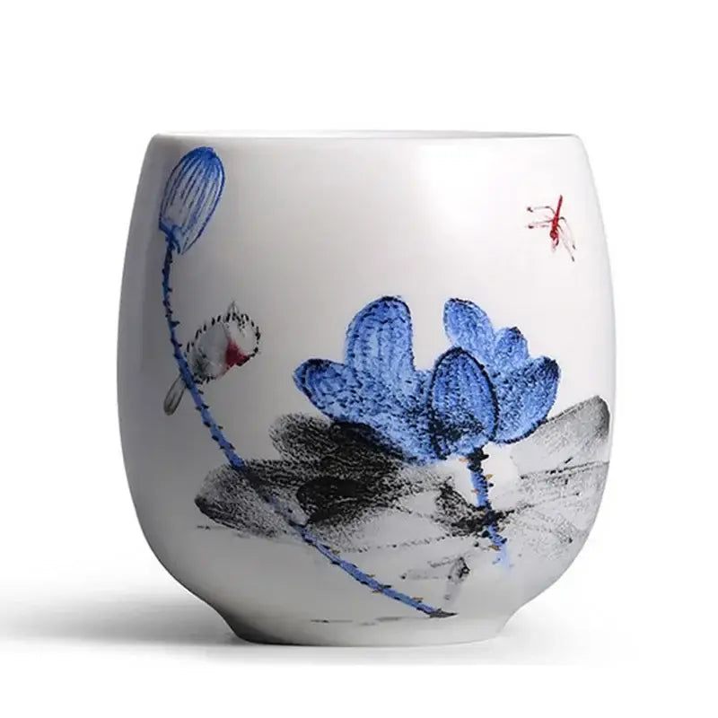 White porcelain kung fu tea cup with hand-painted blue lotus blossoms black ink leaves and red dragonfly decorbites ceramic kung