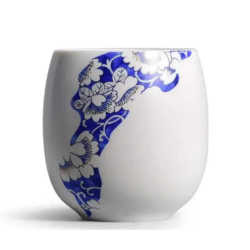 Hand-painted white porcelain kung fu tea cup with vibrant blue floral pattern by decorbites ceramic kung for dining room