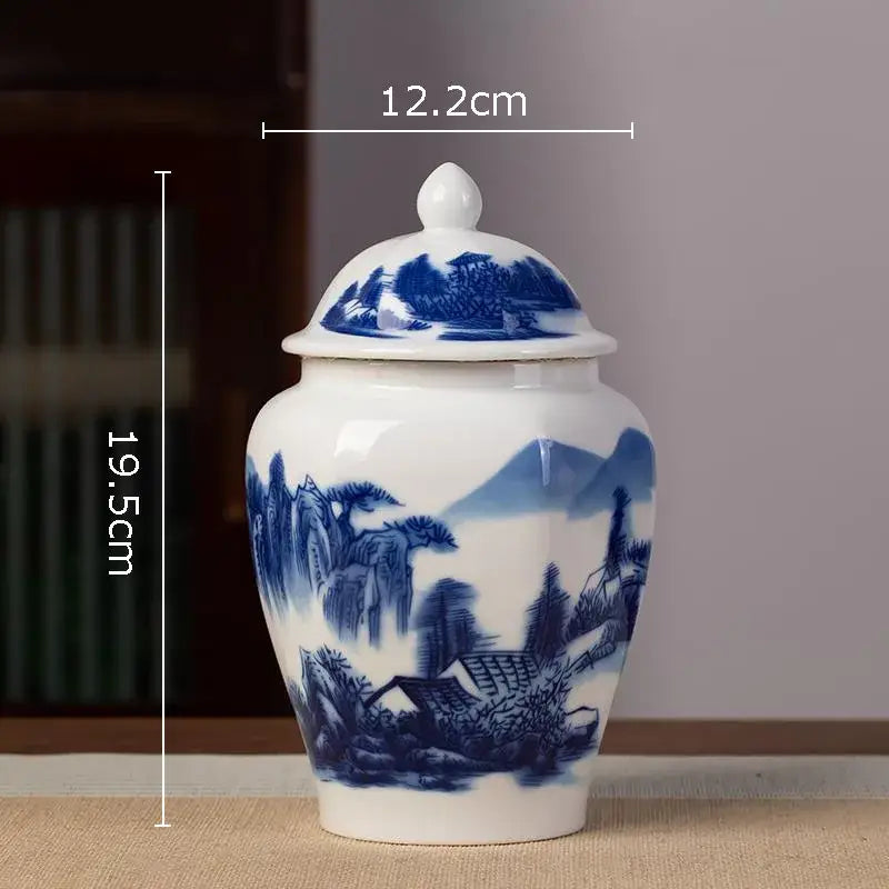 White porcelain tea canister with hand-painted blue and white landscape design for kitchen storage and tea preservation