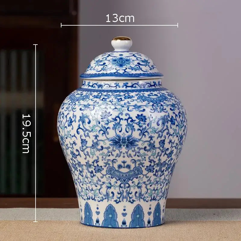 Hand-painted blue and white porcelain tea canister with intricate floral patterns and gold-accented lid for kitchen storage