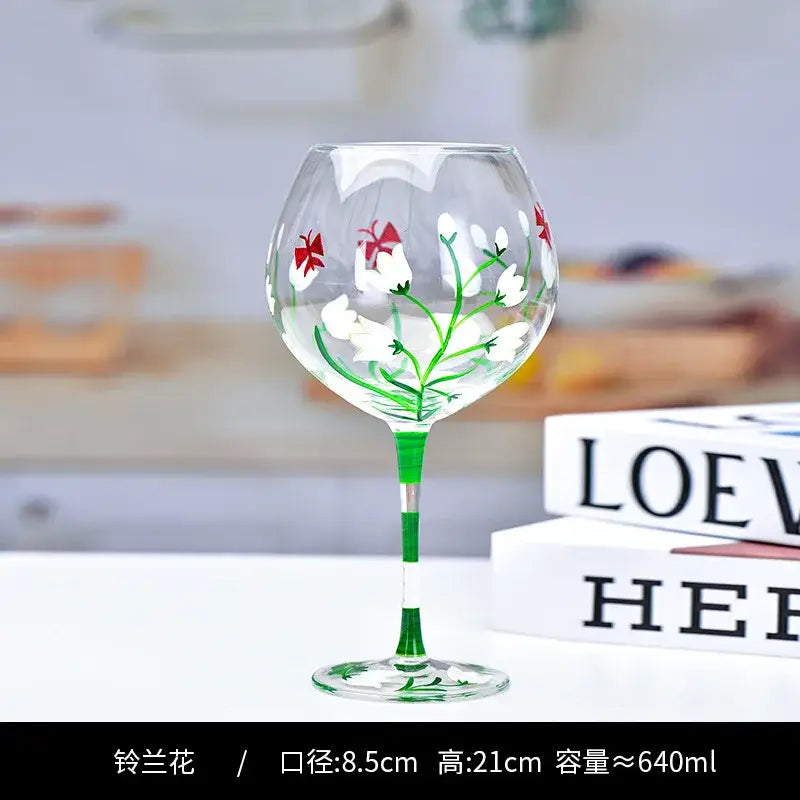 Hand-painted floral wine goblet with white snowdrop flowers red bows and green stem from decorbites crystal collection