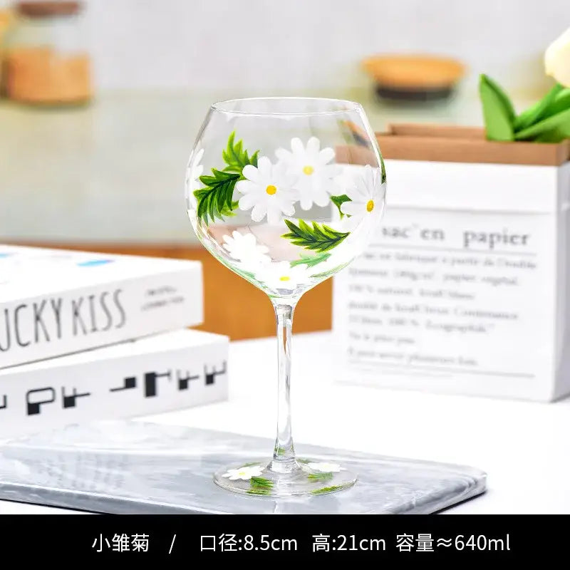 Hand-painted floral wine goblet with white daisies green leaves on crystal glass by decorbites for dining room use