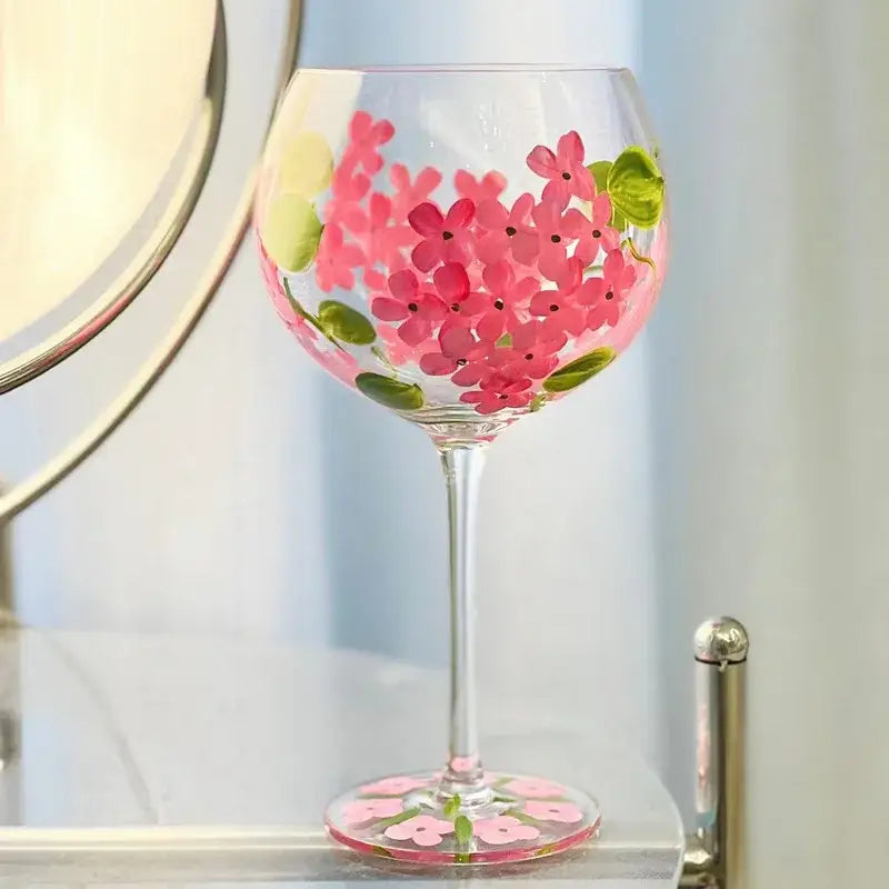 Hand-painted floral wine goblet with vibrant pink flowers and green leaves on clear crystal glass by decorbites crystal