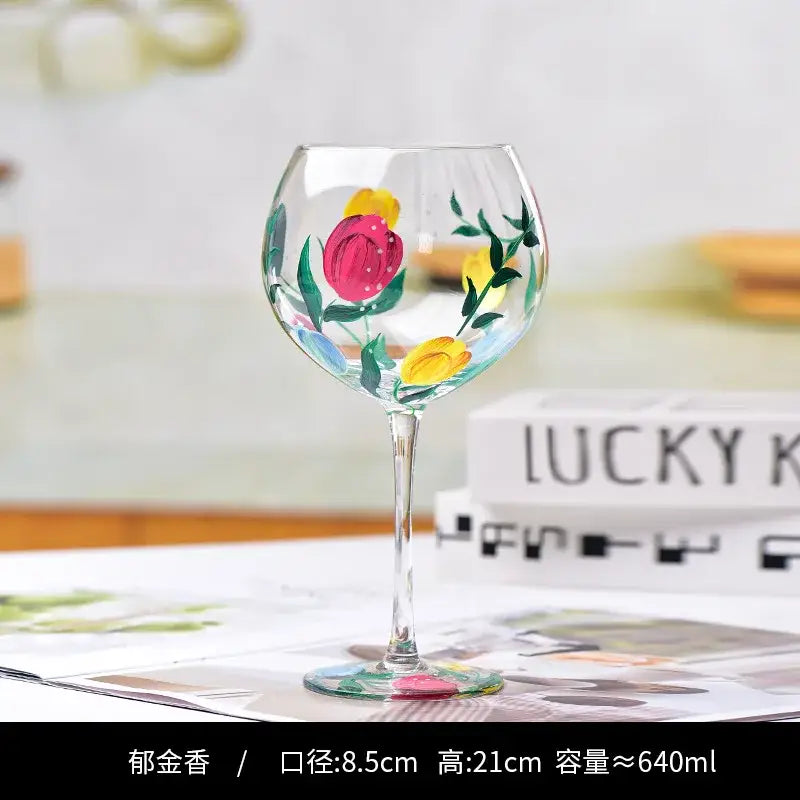 Hand-painted floral wine goblet with vibrant pink and yellow tulips on clear decorbites crystal glass