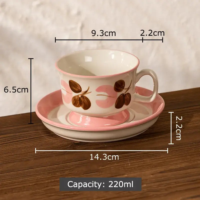 A delicate pink and white hand-painted flowers pattern ceramic cup and saucer set with decorbites flowers pattern