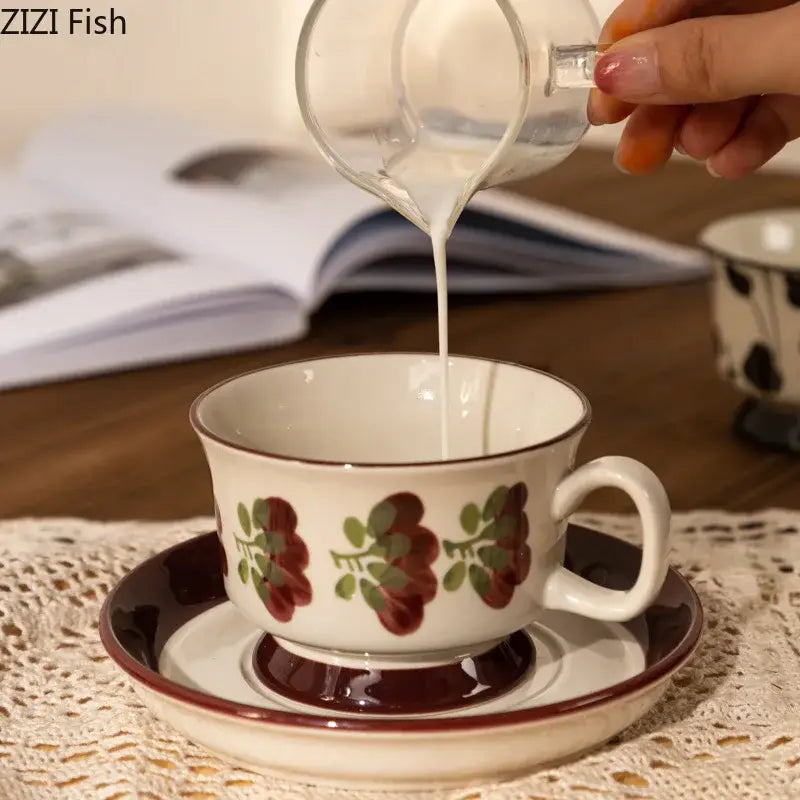 White ceramic teacup and saucer set with hand-painted decorbites flowers pattern for elegant dining room decor