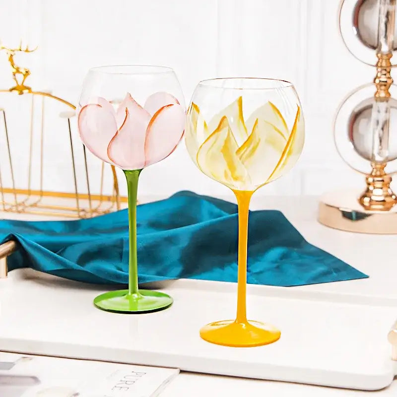 Hand painted glass goblet set with pink lotus and yellow floral designs for elegant dining room decor