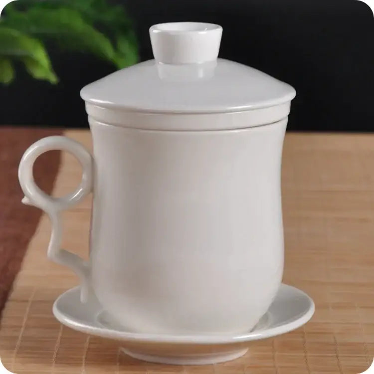Hand painted lotus white porcelain tea cup with filter featuring a smooth glossy finish on matching lid and saucer