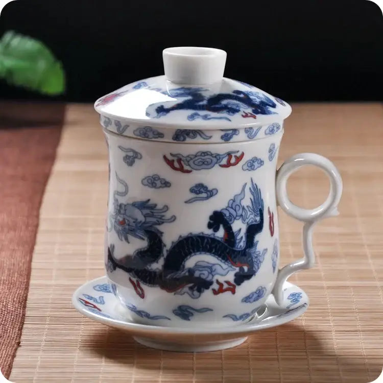 Hand painted white porcelain tea cup with filter featuring blue and red dragon motifs for dining room use