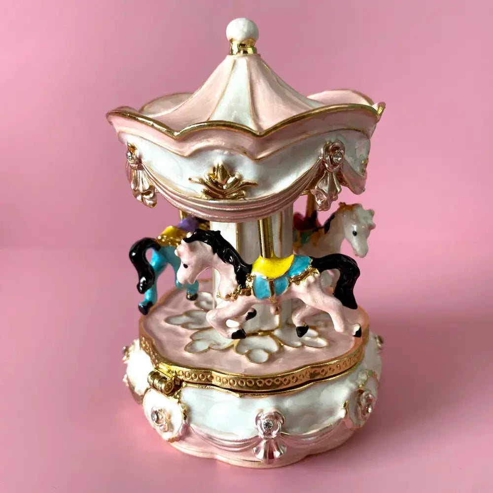Hand painted pastel carousel horse trinket box with delicate pink and gold details featuring ornate carousel horse figurines