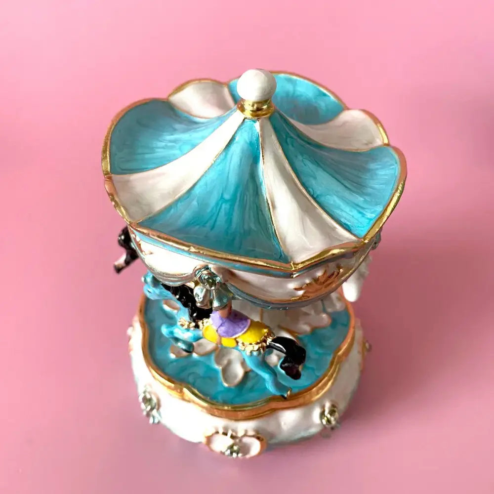 Hand painted pastel turquoise and white enamel carousel horse trinket box with gold trim and miniature rider figurine