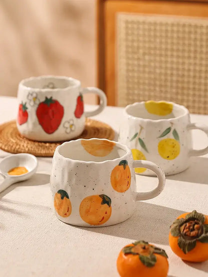 White ceramic cartoon fruit ceramic mugs with speckled texture and hand-painted red yellow orange fruit decorbites cartoon fruit