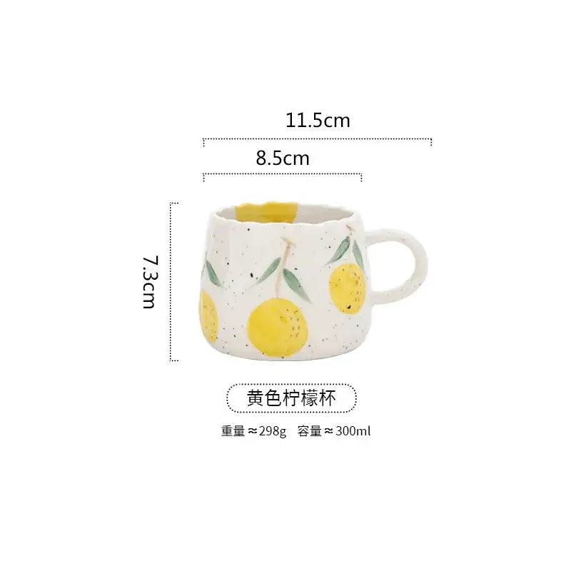 Hand-painted cartoon fruit ceramic mug with speckled white texture featuring yellow lemons and green leaves for kitchen use