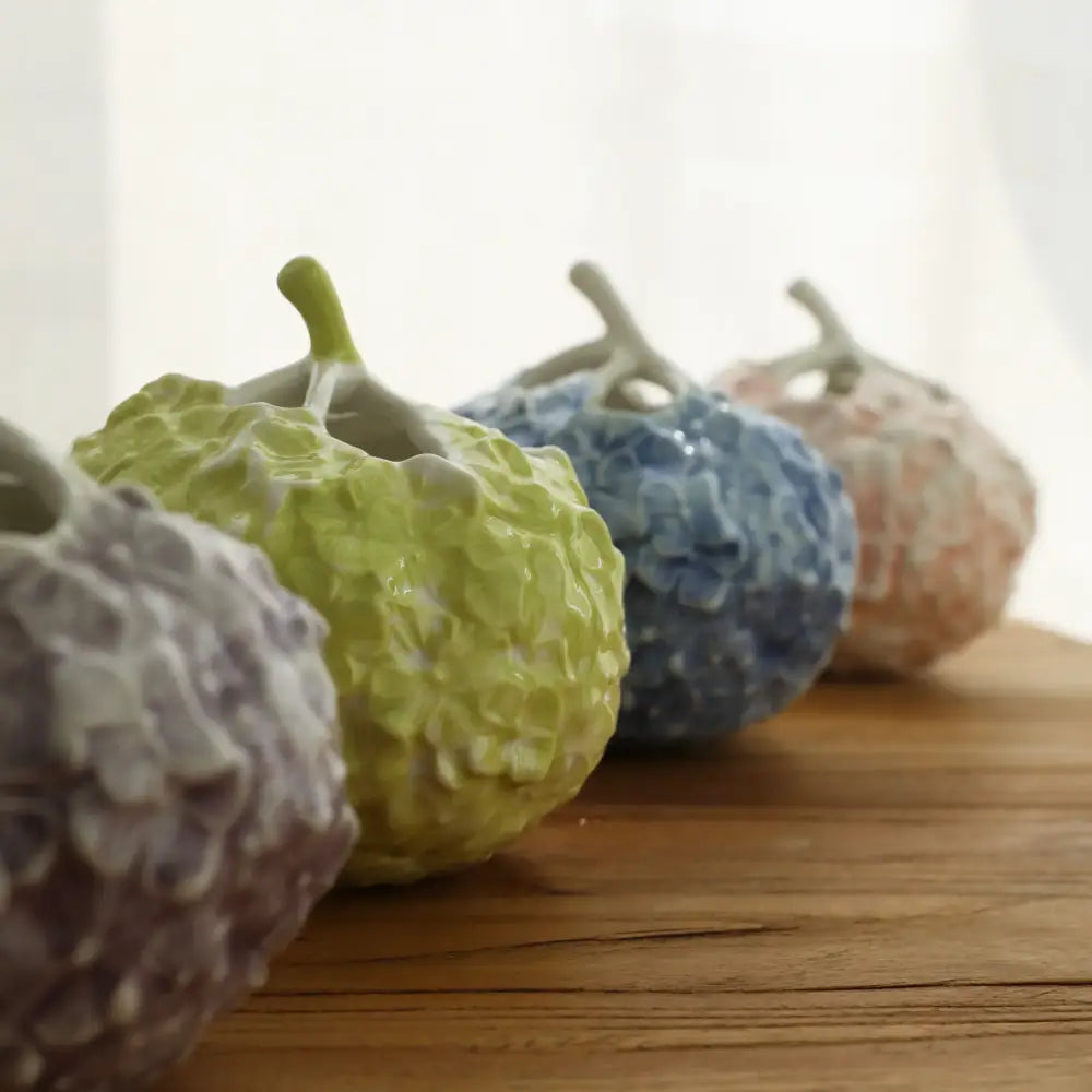 A collection of decorbites hydrangea ceramic vases in pastel hues with hand-relief textured surfaces for living room decor