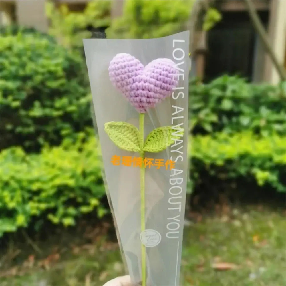 Hand woven love heart yarn crochet lavender flower with green leaves in clear sleeve for bedroom decor