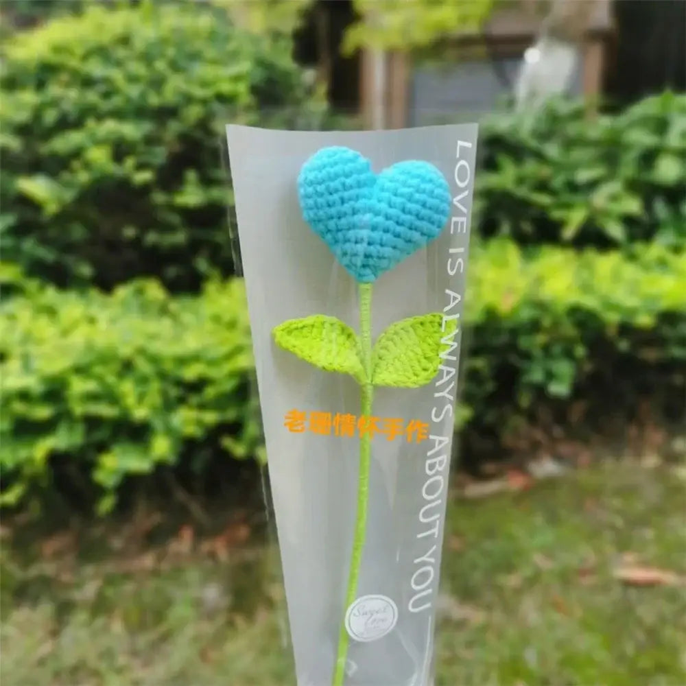 Hand woven love heart yarn crochet blue flower with green leaves in clear sleeve bedroom decor bouquet