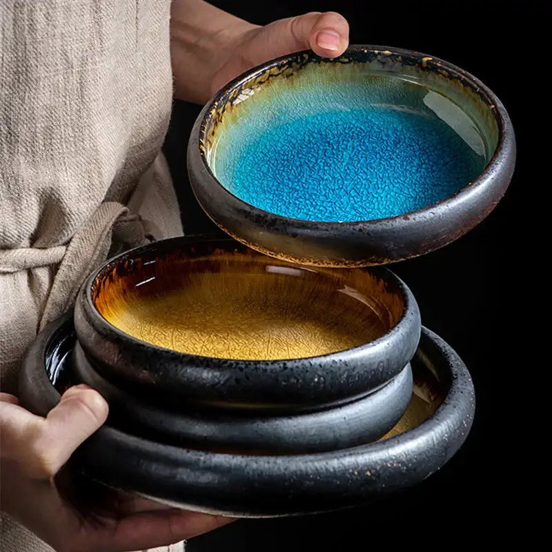 Handcrafted ceramic sushi plate with vibrant blue and gold glazes, crackled texture, and speckled exterior for dining