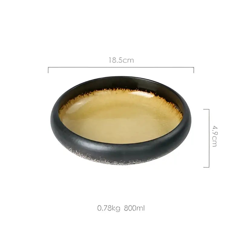 Black ceramic sushi plate with golden interior glaze and speckled rim handcrafted ceramic sushi plate for dining