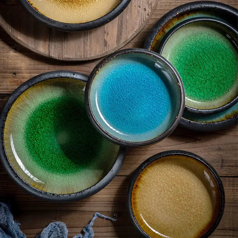 Handcrafted ceramic sushi plates with glossy blue and green gradient glazes for elegant dining room tableware