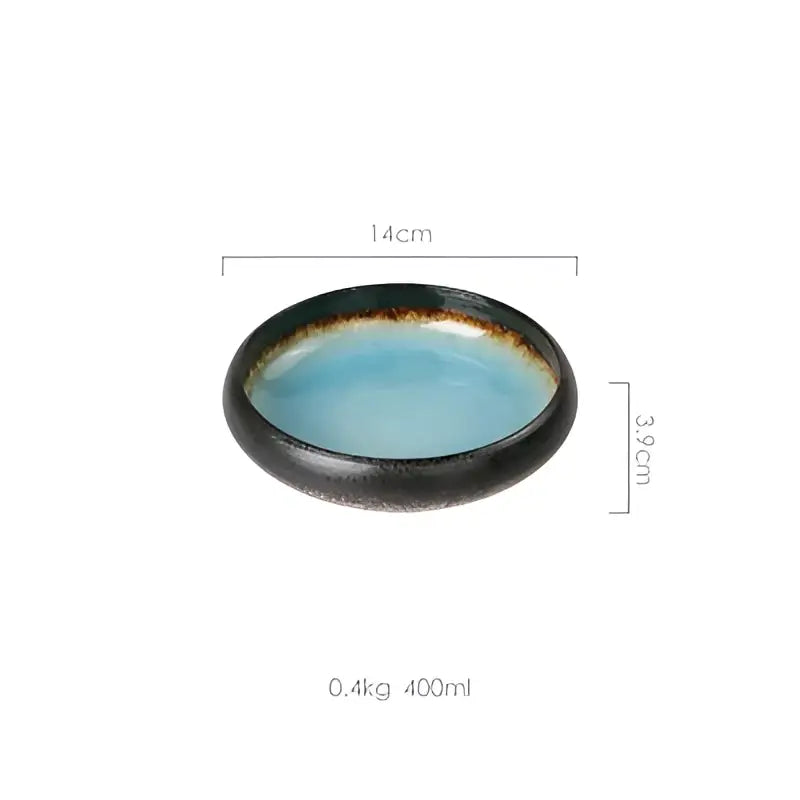 A sleek ceramic sushi plate with a glossy turquoise interior and dark earthy rim handcrafted for dining use