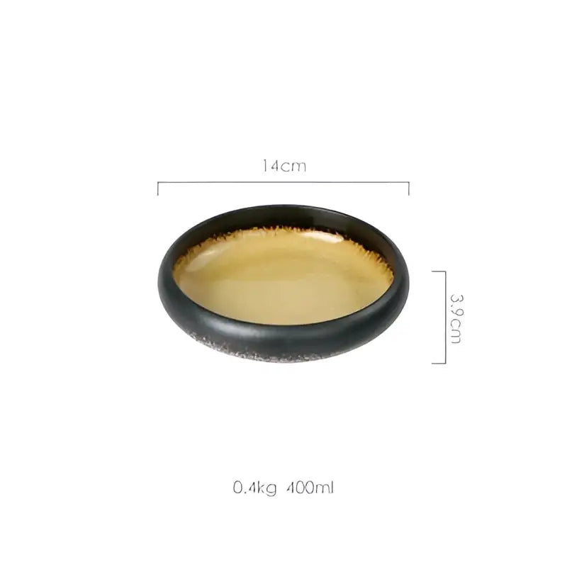 Handcrafted ceramic sushi plate with black exterior golden interior and speckled rim measuring 14cm diameter