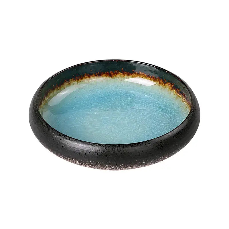 Handcrafted ceramic sushi plate with glossy turquoise crackle glaze interior and black rim with brownish-gold band