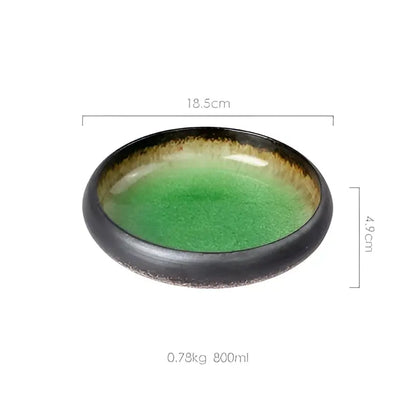 Handcrafted ceramic sushi plate with glossy black rim, vibrant green interior, and subtle gold speckles for elegant dining