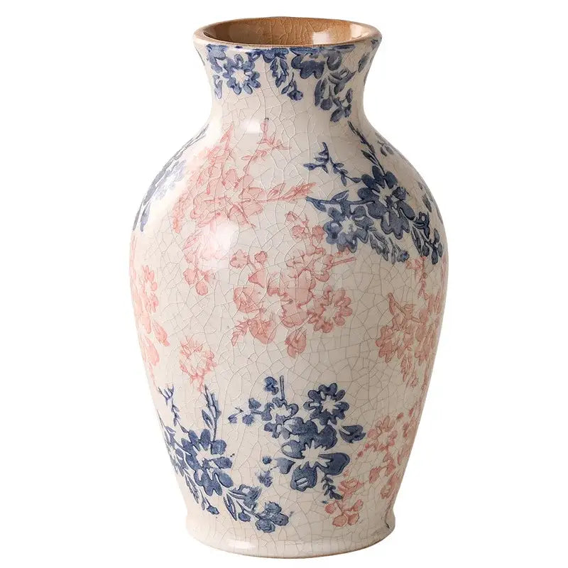 A crackled cream white ceramic vase with pink and blue floral patterns from decorbites for living room decor
