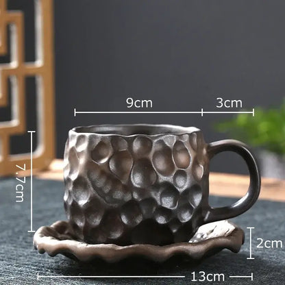 Handcrafted dark brown hammer pattern ceramic mug set with textured surface and matching saucer for dining room use