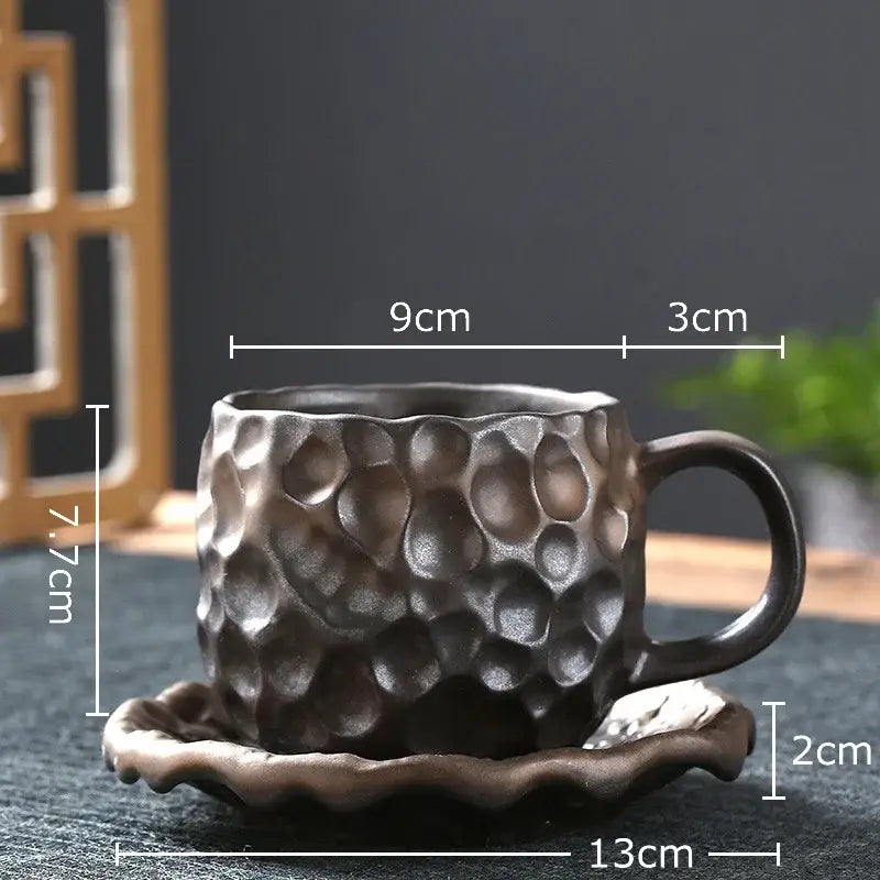 Handcrafted dark brown hammer pattern ceramic mug set with textured surface and matching saucer for dining room use