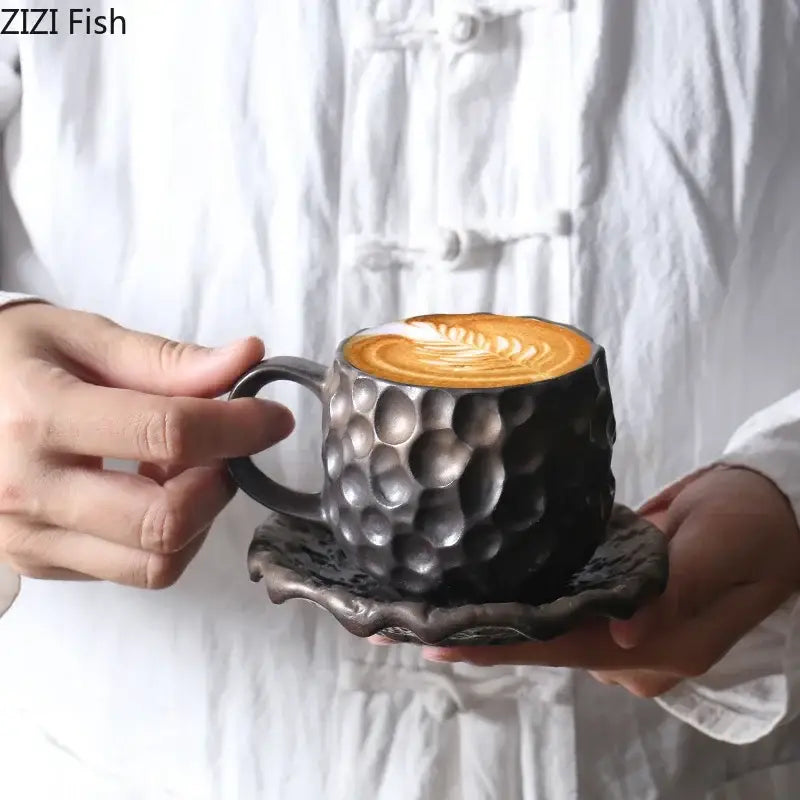 Dark gray hammered ceramic mug with matching saucer featuring textured surface in handcrafted hammer pattern ceramic mug set