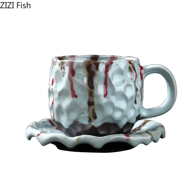 Handcrafted white hammered finish ceramic mug with red and brown glaze on scalloped saucer from ceramic mug set