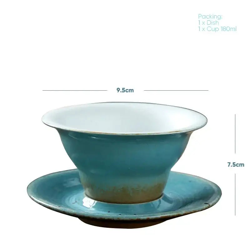 Handcrafted ceramic latte coffee cup and saucer in turquoise with white interior featuring subtle glaze variations