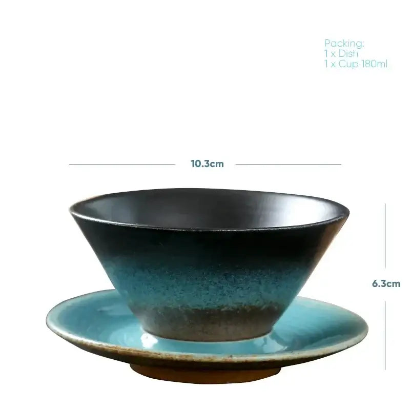 Handcrafted ceramic latte coffee cup and saucer with gradient black to turquoise glaze for dining room use