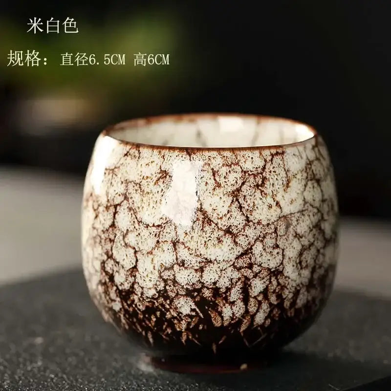 Handcrafted crackled white egg style ceramic tea cup with brown glaze and textured surface for dining room use