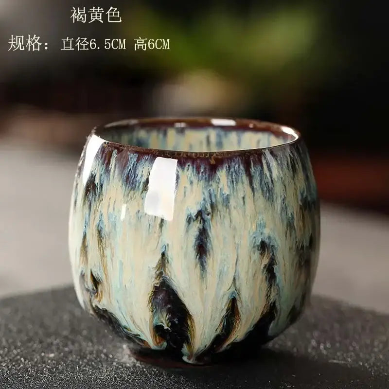 Handcrafted colorful egg style ceramic tea cup with glossy swirling glaze of beige blue and brown for dining room use