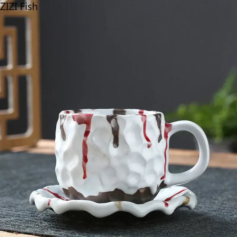 White ceramic hammer pattern porcelain mug with textured hammered surface and decorative red and brown drips in set of 2